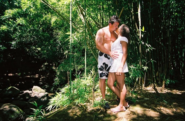 Jamillah and Brandon in the Nuuanu rainforest, with the clouds above