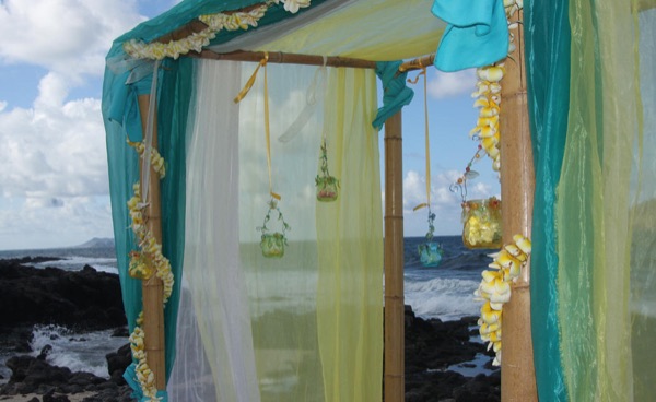 The turquoise draped gazebo by the ocean