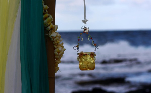 A hanging lantern with the ocean behind