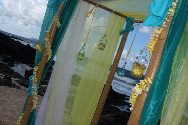 The turquoise and green gazebo on the beach
