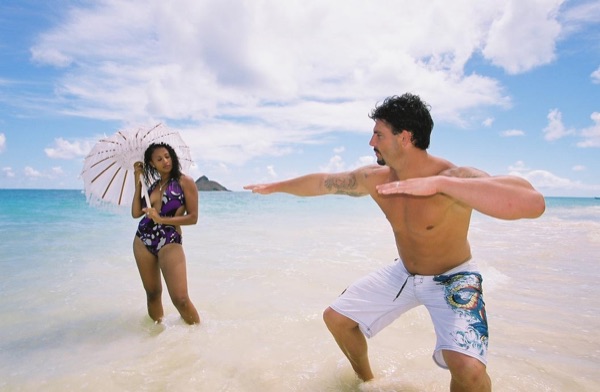 Jamillah and Brandon on the white sand at Lanikai, up close