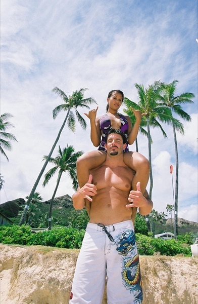 Jamillah and Brandon on the white sand at Lanikai, side by side