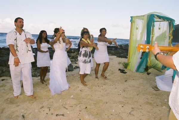 Learning the hula on the beach after the ceremony, smiling