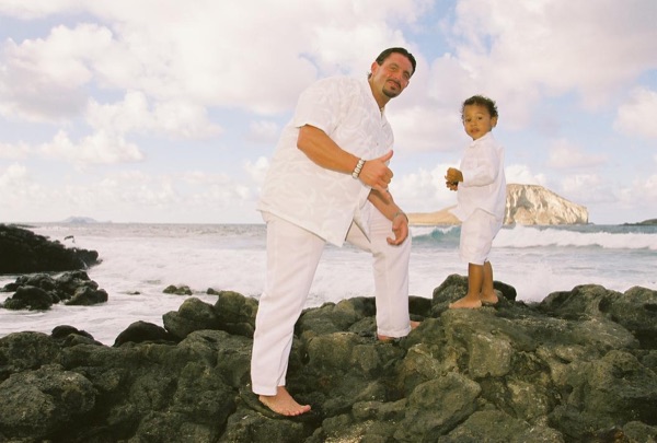 Brandon playing with his son Cameron on the beach, from another angle