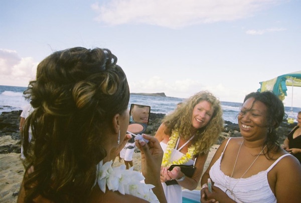 Guests learning the hula with dancer Keveca, side by side