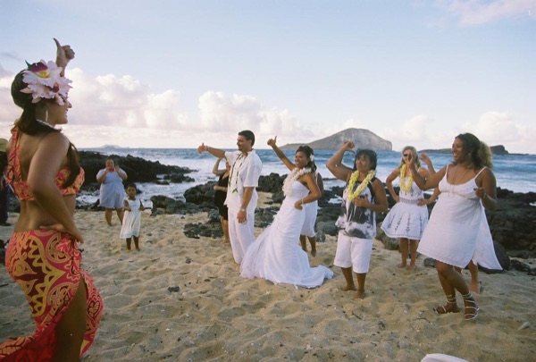 Guests learning the hula with dancer Keveca