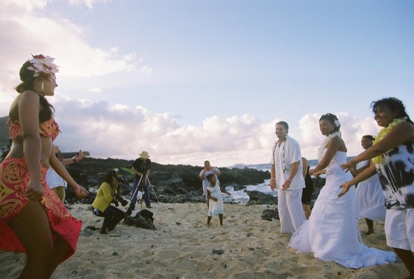 Guests learning the hula with dancer Keveca, smiling