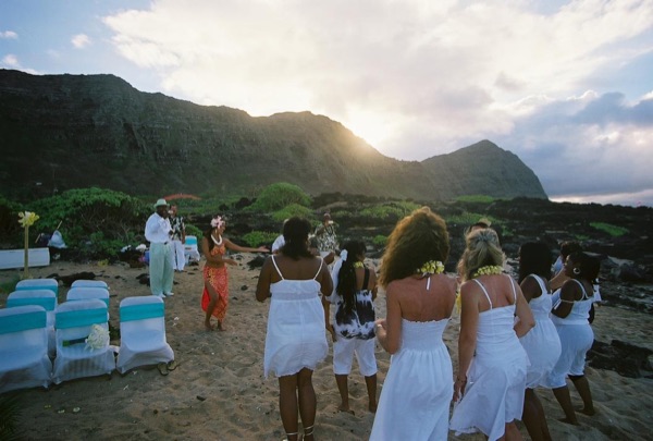 Guests learning the hula with dancer Keveca, laughing together
