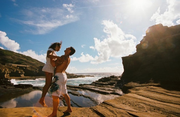 Jamillah and Brandon on the east coast cliffs above the Pacific, in the afternoon light