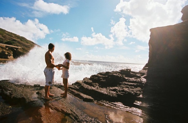 Jamillah and Brandon on the east coast cliffs above the Pacific, in the breeze