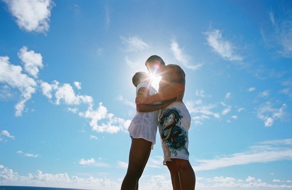 Jamillah and Brandon on the east coast cliffs above the Pacific, in a sweet moment