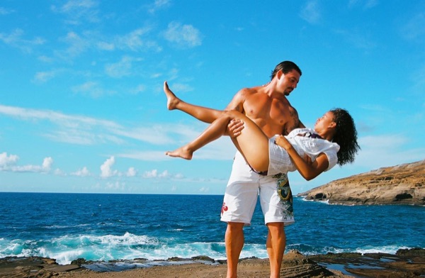 Jamillah and Brandon on the east coast cliffs above the Pacific, laughing together