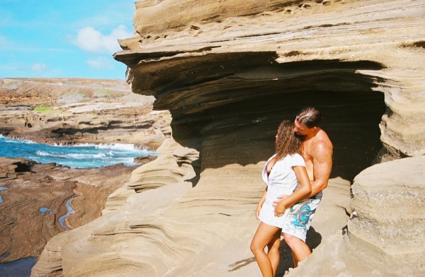 Jamillah and Brandon on the east coast cliffs above the Pacific, side by side