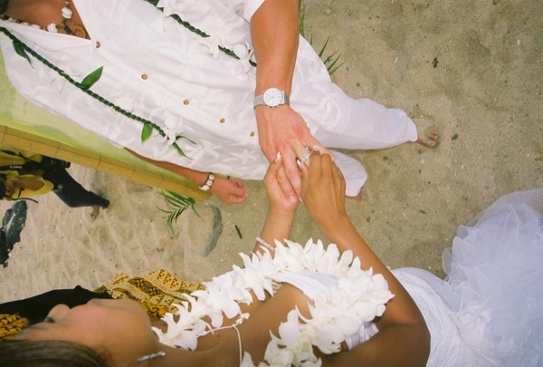Jamillah and Brandon's turquoise themed beach ceremony, close together