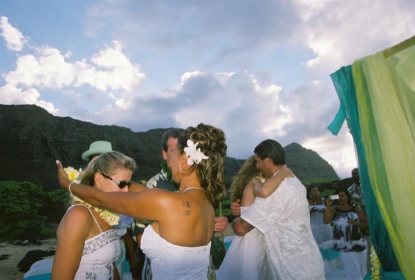 Jamillah and Brandon's turquoise themed beach ceremony, smiling