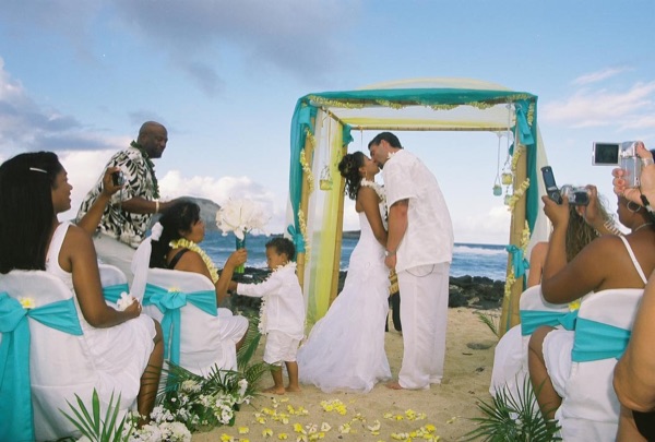 Jamillah and Brandon's turquoise themed beach ceremony, side view