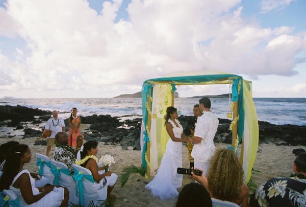 Jamillah and Brandon's turquoise themed beach ceremony, laughing together