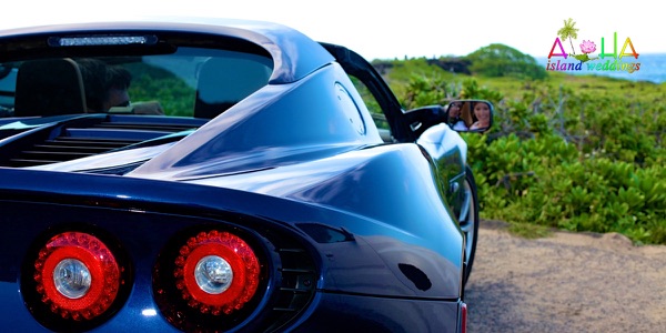 Jennifer and David with the blue Lotus sports car by the sea, photo 5