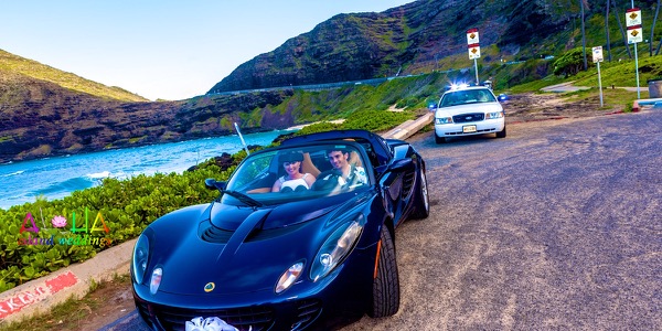 Jennifer and David in the Lotus sports car, another moment