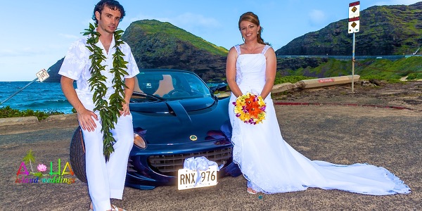 Jennifer and David with the blue Lotus sports car by the sea, photo 4