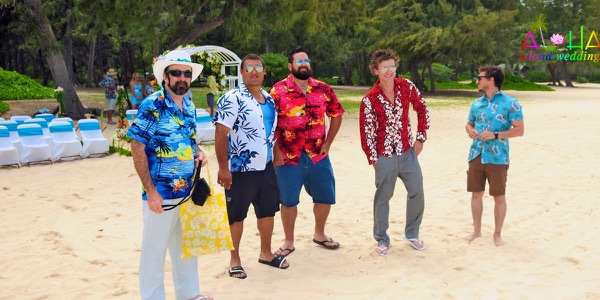 The groomsmen in bright aloha shirts on the beach, another moment