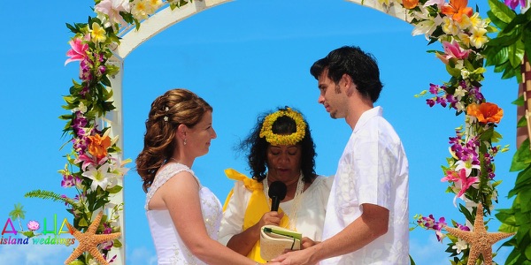 Jennifer and David at the flower arch, one more moment