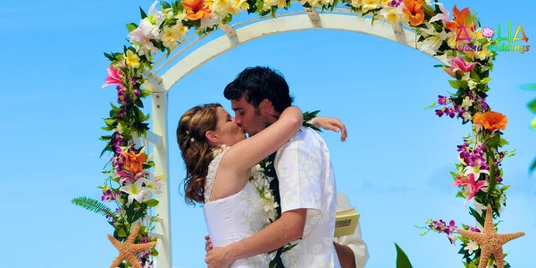 The groomsmen in bright aloha shirts on the beach, more from the day