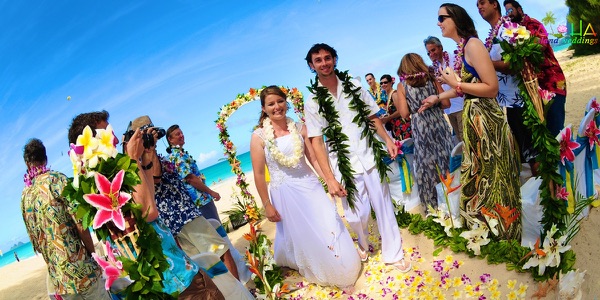 The bridal party on the sand, another view