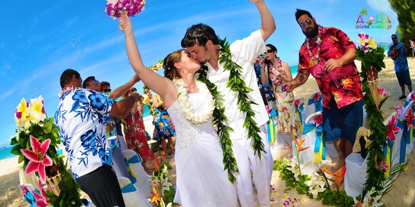 Guests watching the ceremony by the turquoise water, another photo