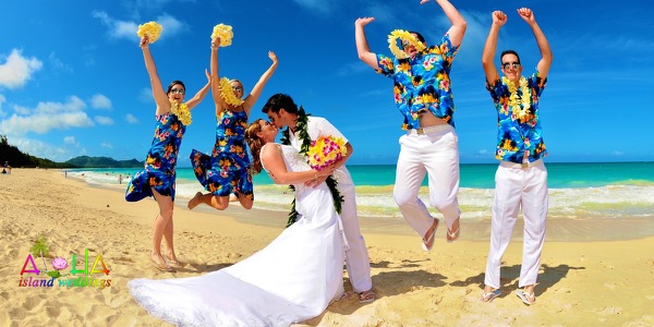 The groomsmen in bright aloha shirts on the beach, a moment later