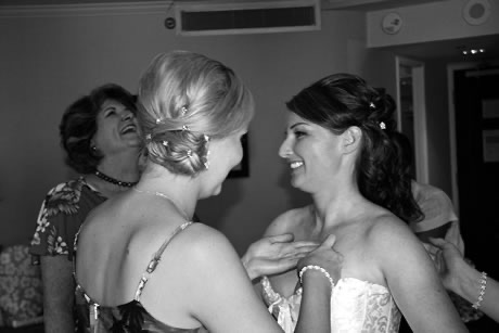 Mom laughs with the bride Jennifer