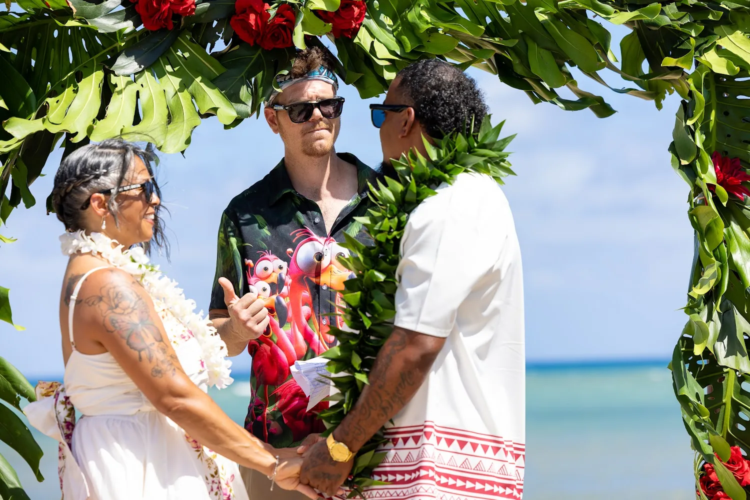 The ceremony beside the carved tiki statues