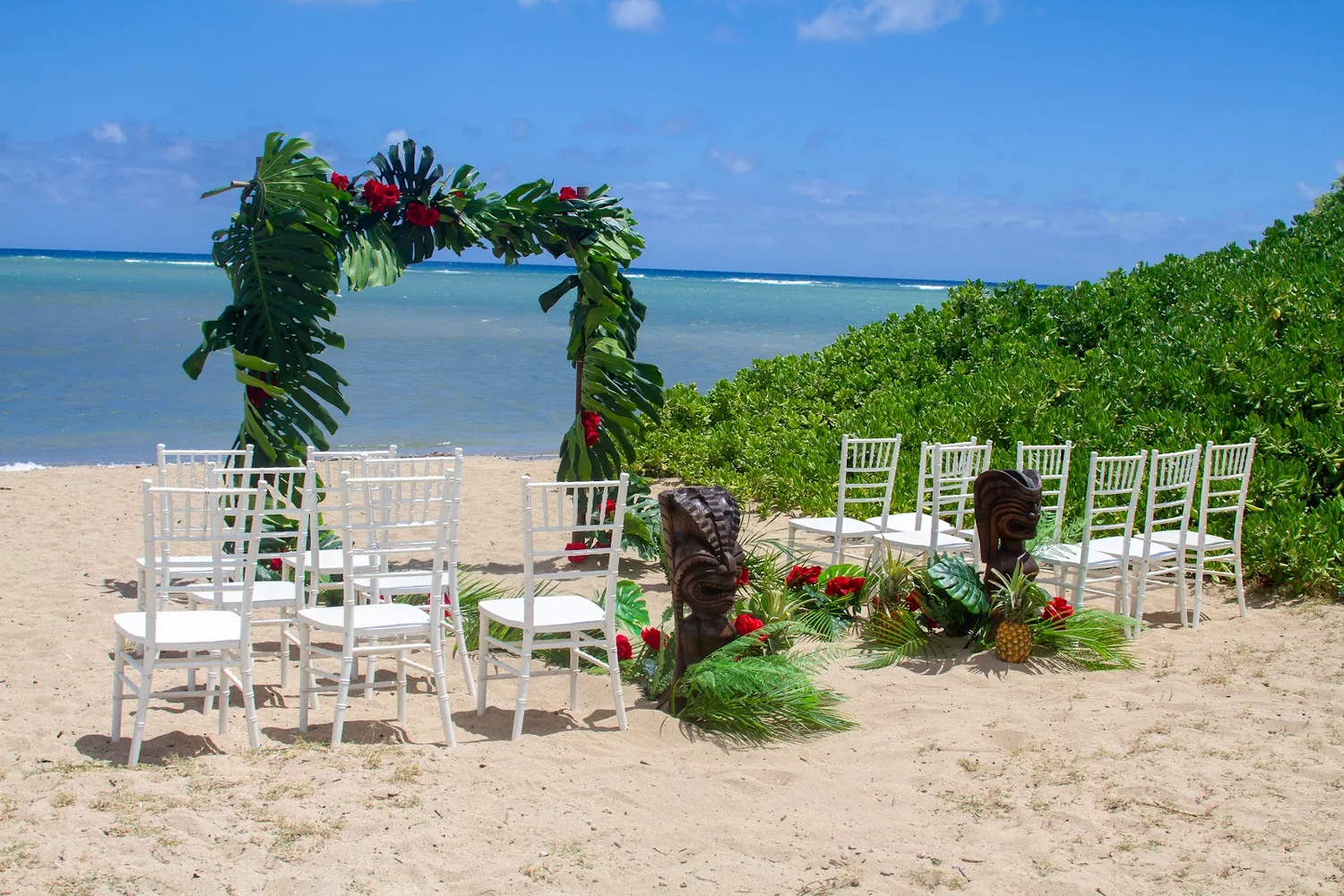The ceremony setup on the sand at Waialae Beach Park