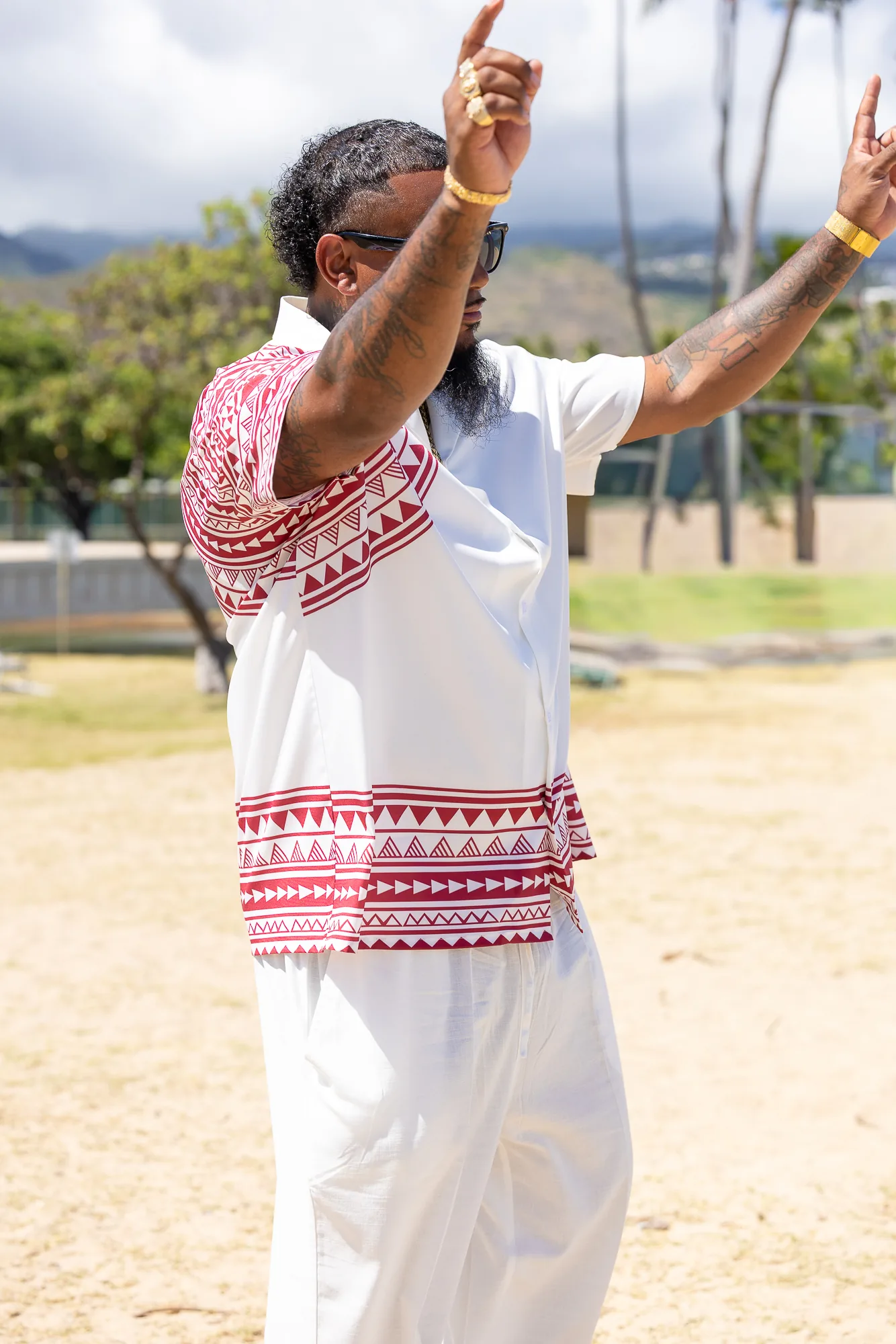 Erick with his arms raised, ready for the ceremony