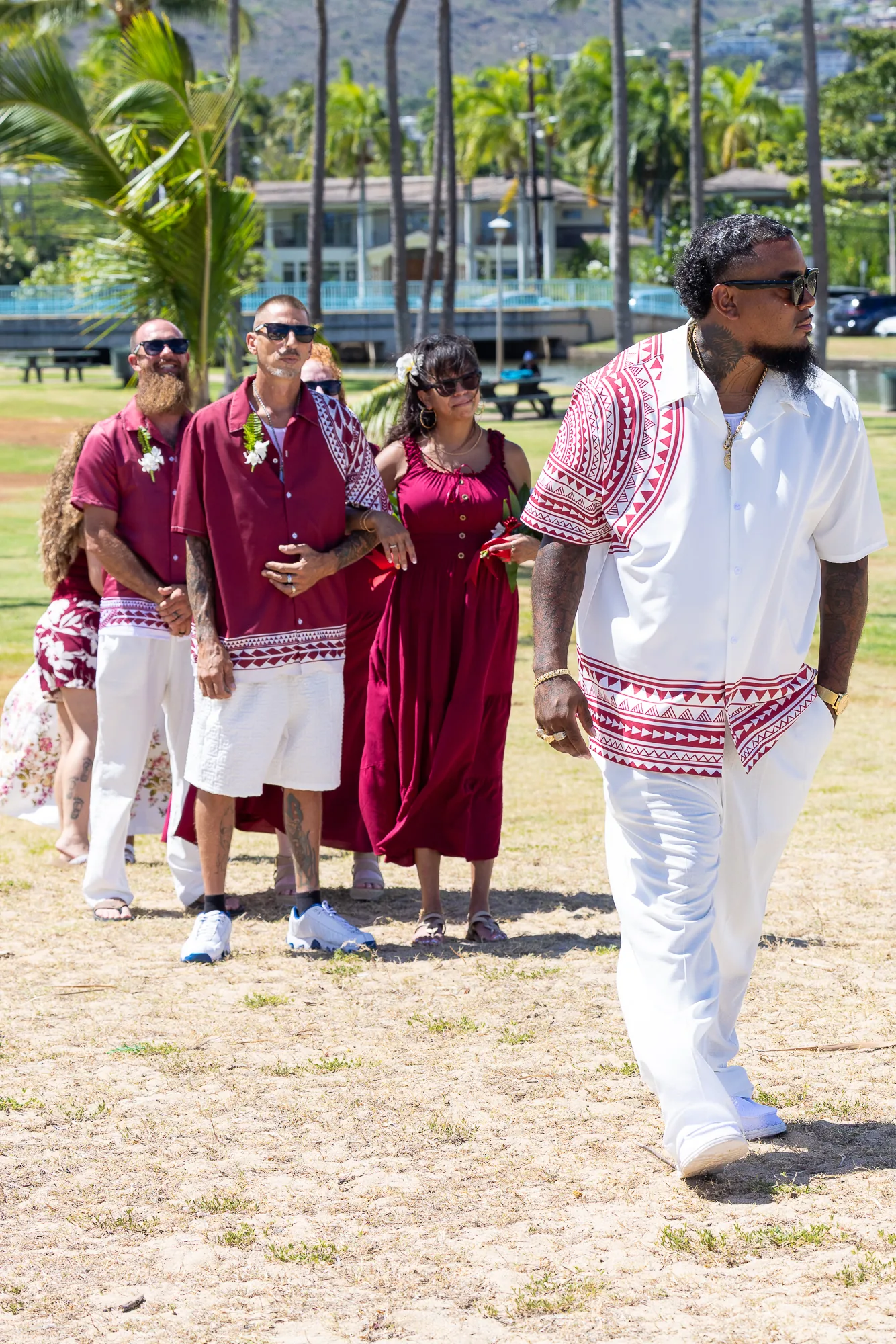 Erick leading the bridal party across the park