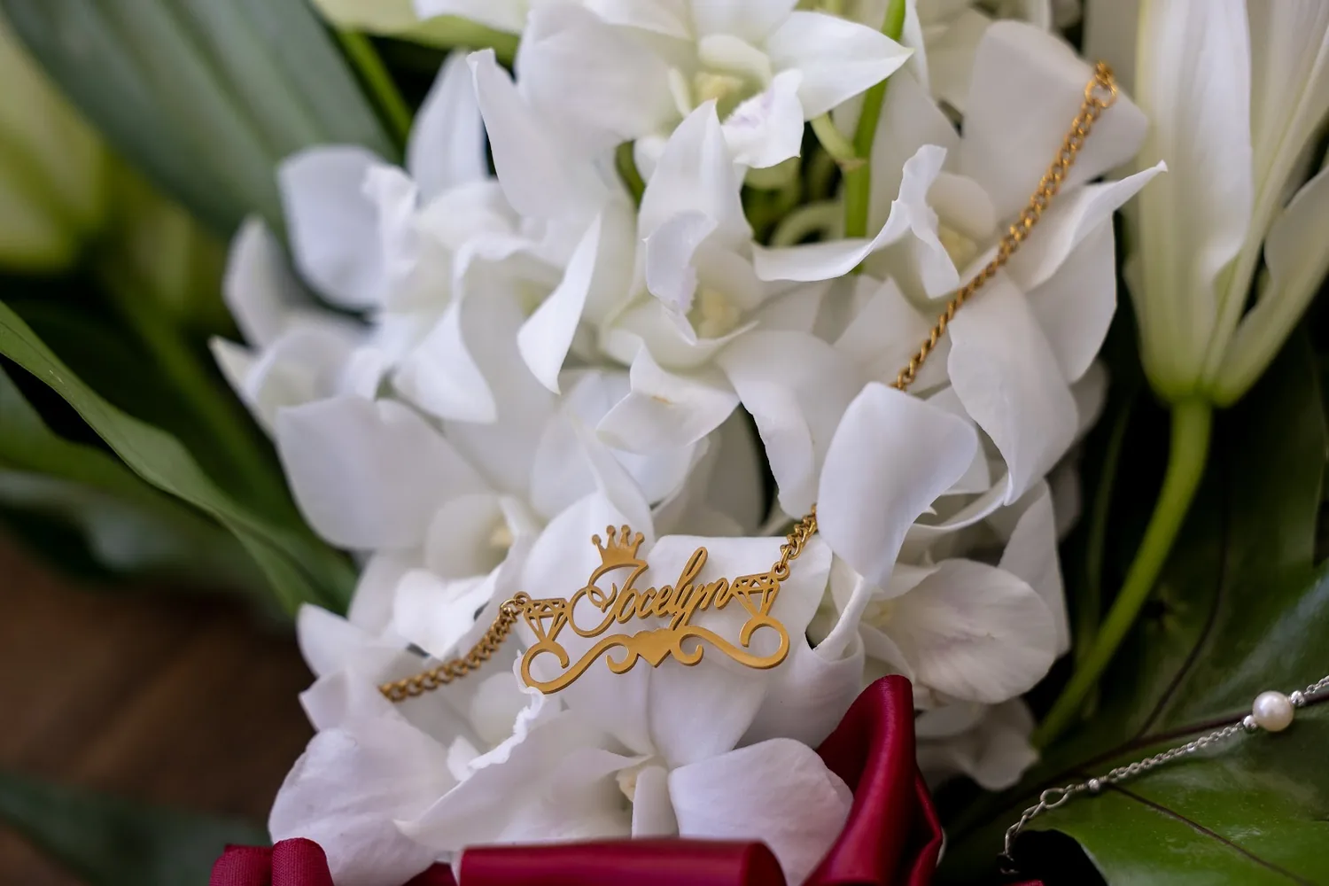 A gold charm tucked into white flowers
