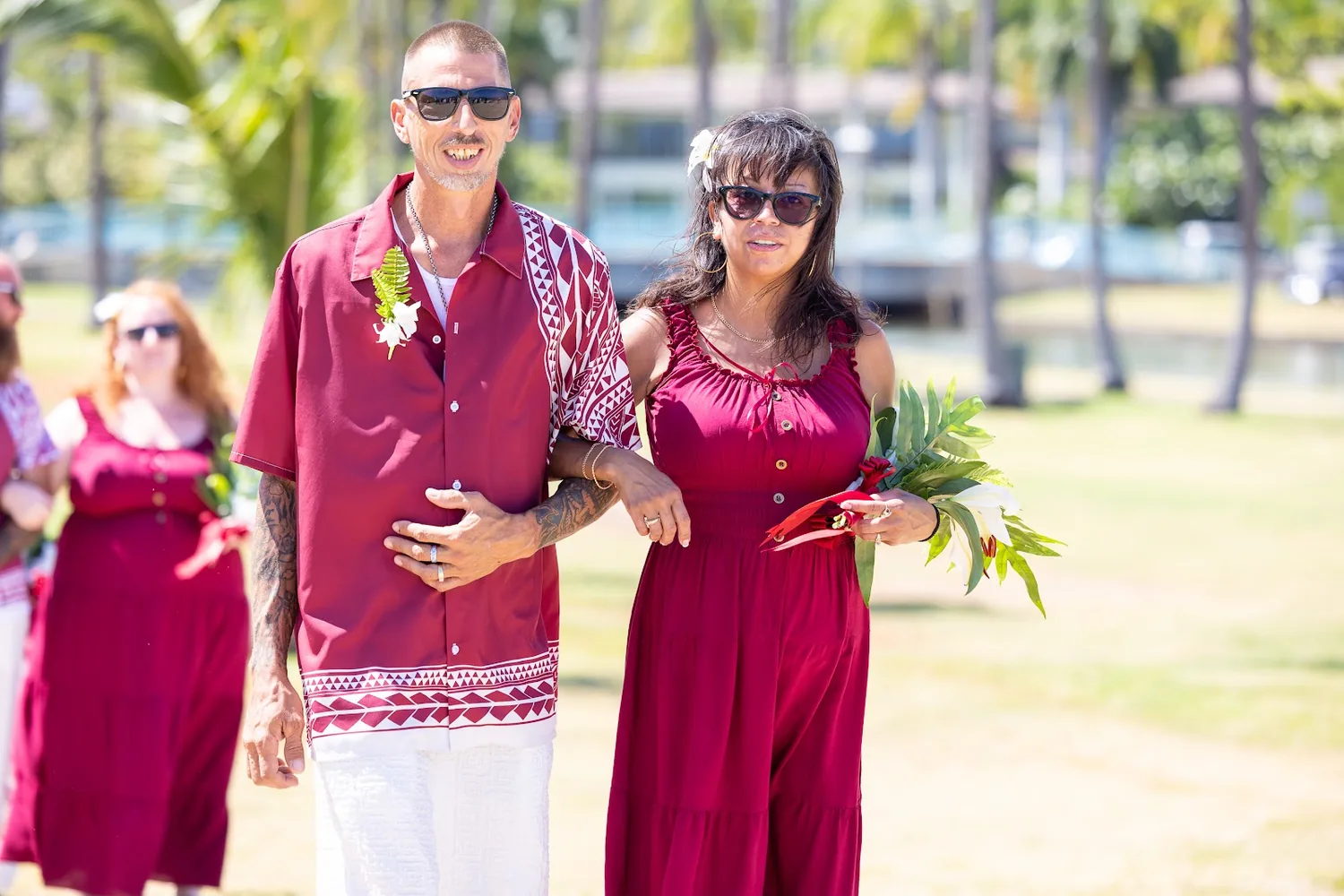A groomsman and bridesmaid walking in