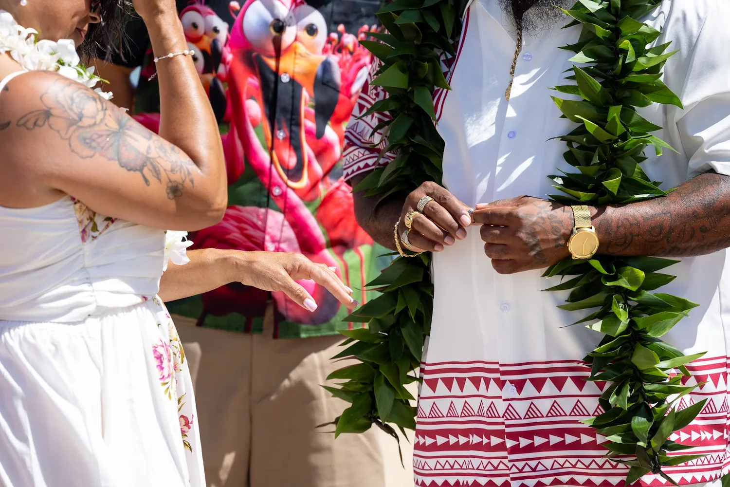Close up of the ring exchange with maile leis