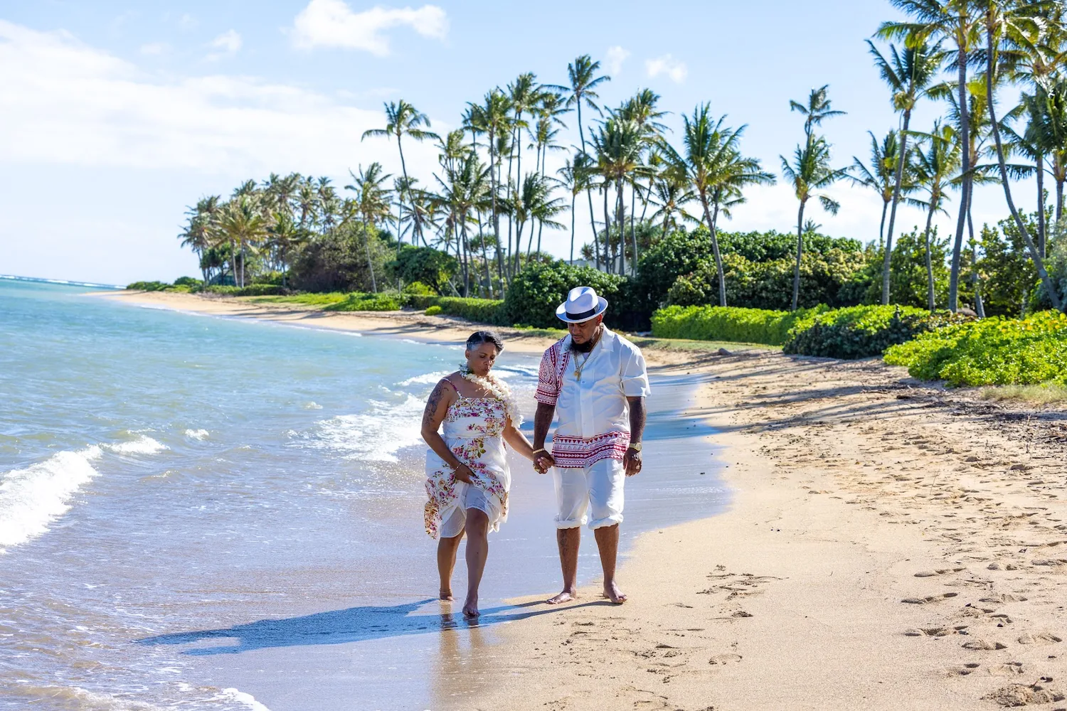 Walking the shoreline with the palms behind