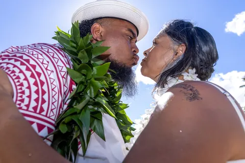 A close up kiss under the blue sky