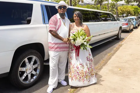 Jocelyn and Erick beside the white limo