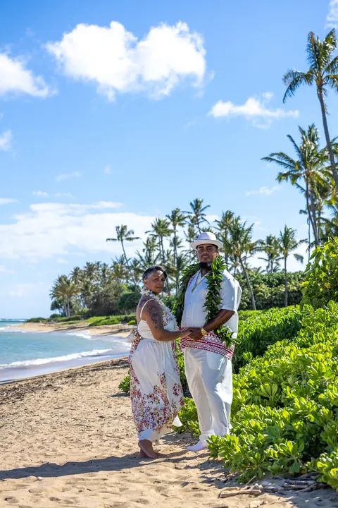 Jocelyn and Erick under tall palm trees