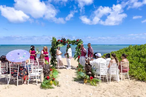 Guests tossing petals as the couple walks back down the aisle