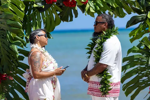 Their vows with the ocean behind them