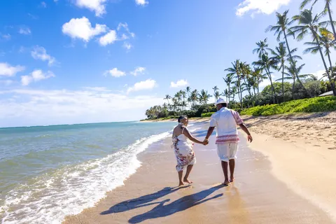 Walking hand in hand toward the palms