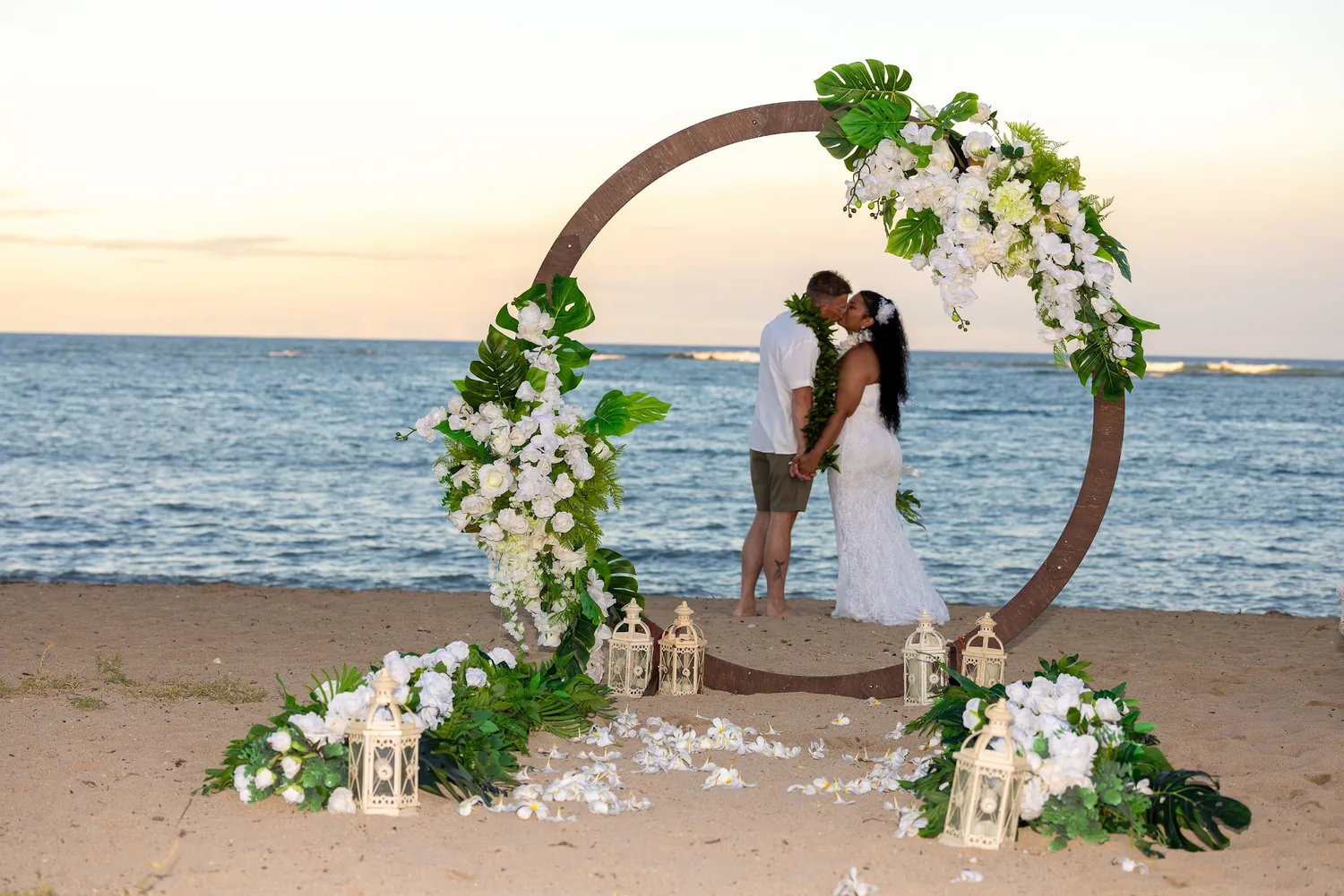The circle archway at sunset with the couple