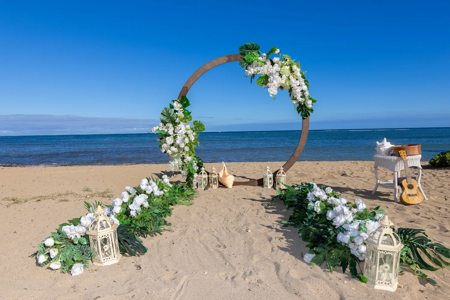 The circle archway and flower aisle under a clear blue sky