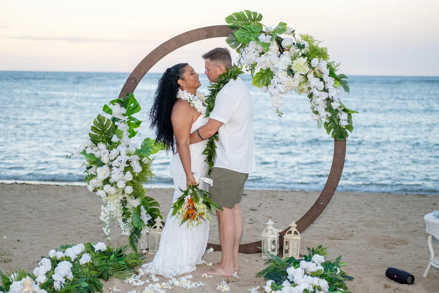 The couple at the archway as the sun goes down