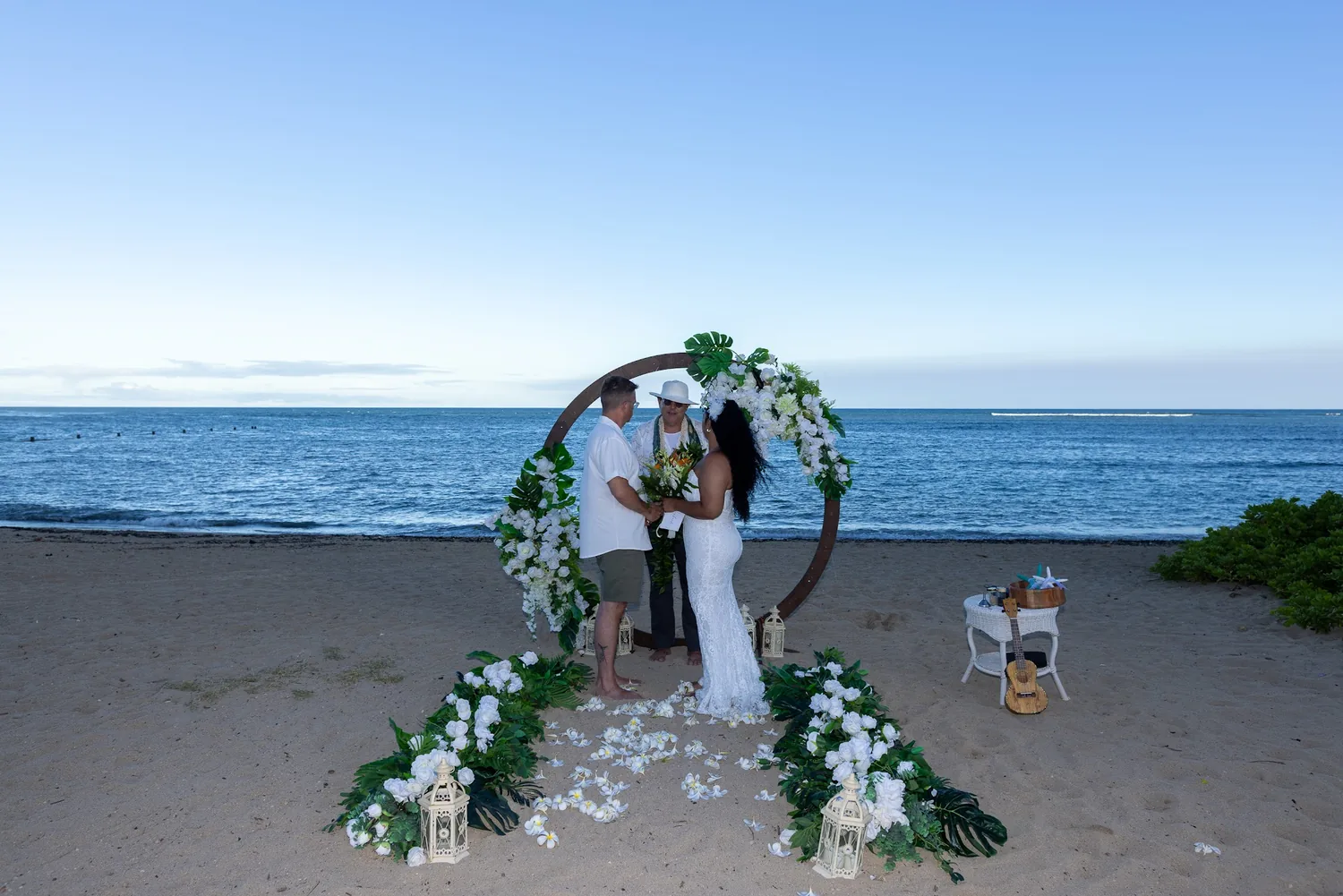 John and Dianna framed by the circle archway with the ocean behind them