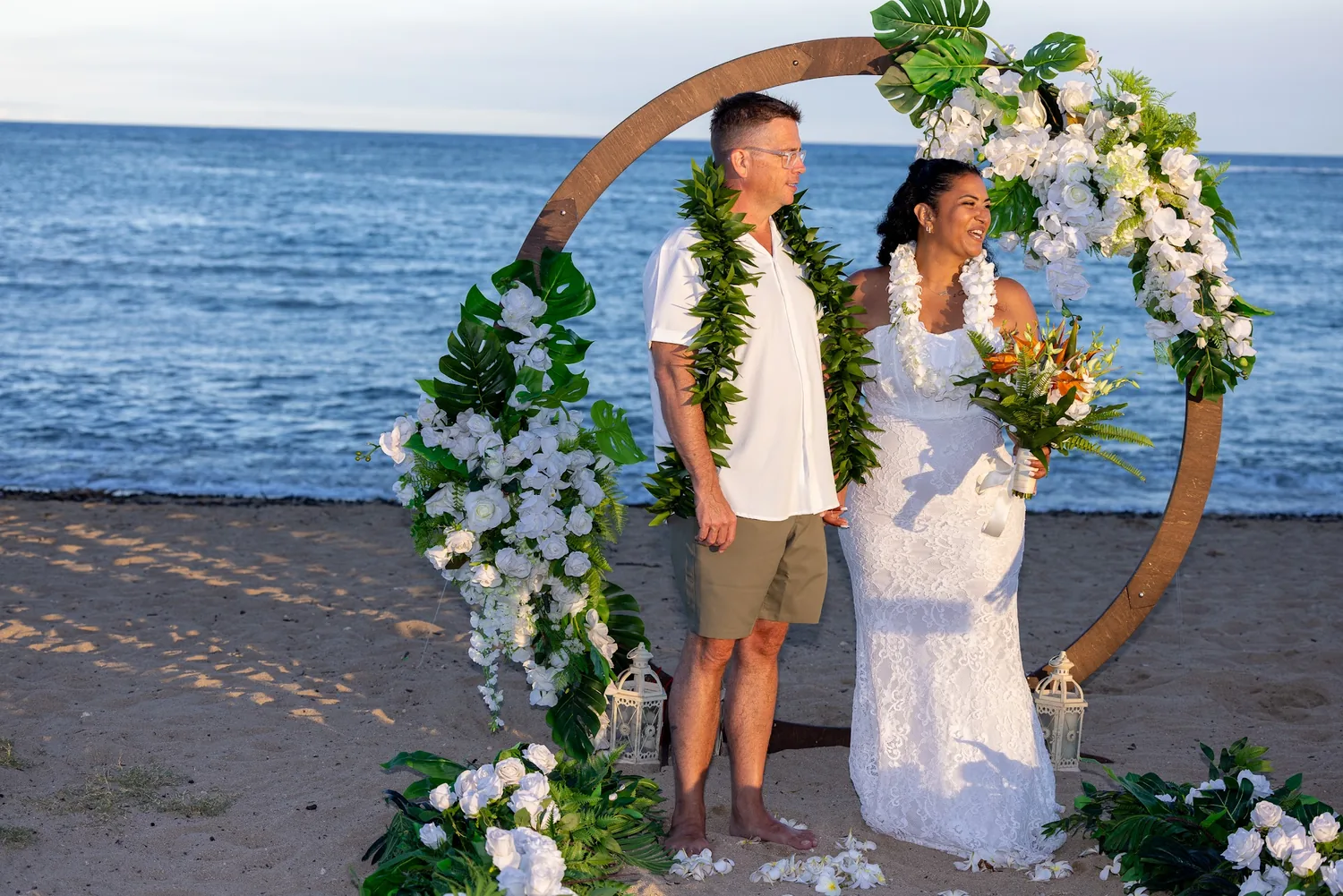 Standing together in the circle archway by the ocean